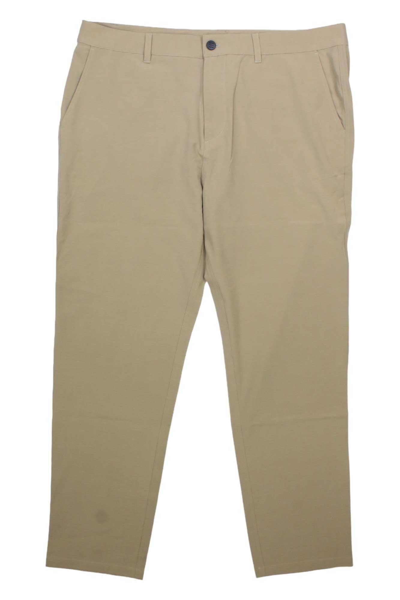 Free Fly Men's Tradewind Pant in beige, featuring UPF 50 fabric, side pockets, belt loops, button closure, and zip fly, shown laid flat on a white background.