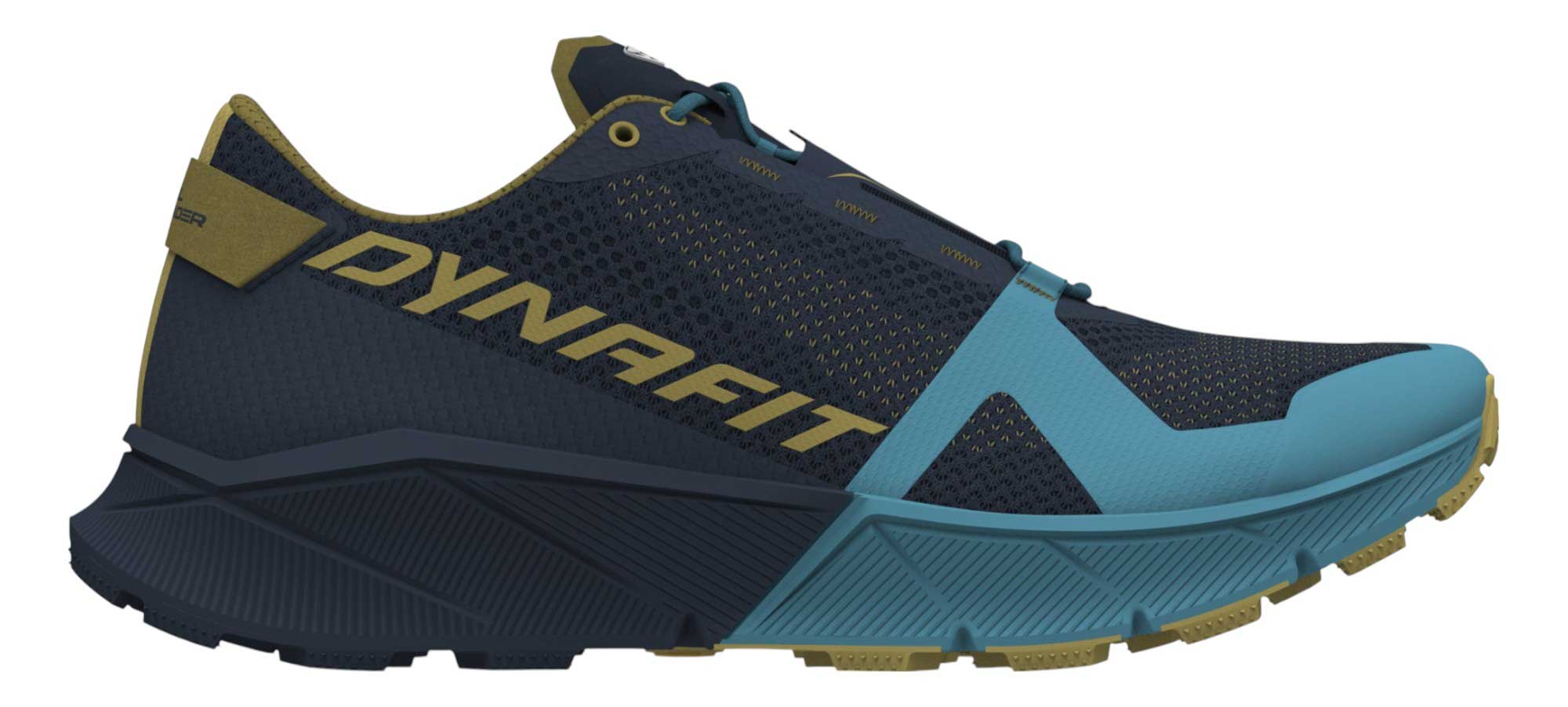 The Dynafit Mens Ultra 100 Shoe features a navy blue and mustard yellow mesh upper, light blue accents on the sole and sides, bold yellow DYNAFIT branding, and a durable Vibram outsole for superior grip.