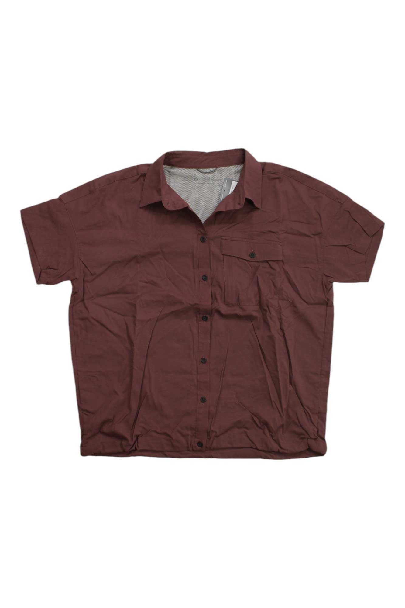 The Eddie Bauer Travex Womens Pave The Way SS Shirt is a reddish-brown, short-sleeve button-up with a left chest pocket, featuring moisture-wicking fabric and UPF 50 sun protection, shown flat on a white background.
