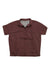 The Eddie Bauer Travex Womens Pave The Way SS Shirt is a reddish-brown, short-sleeve button-up with a left chest pocket, featuring moisture-wicking fabric and UPF 50 sun protection, shown flat on a white background.
