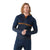 A man with wavy, shoulder-length hair wears a navy Smartwool Mens Intraknit Merino Tech 1/2 Zip Hoodie with an orange stripe, designed for outdoor activity, standing against a plain white background.