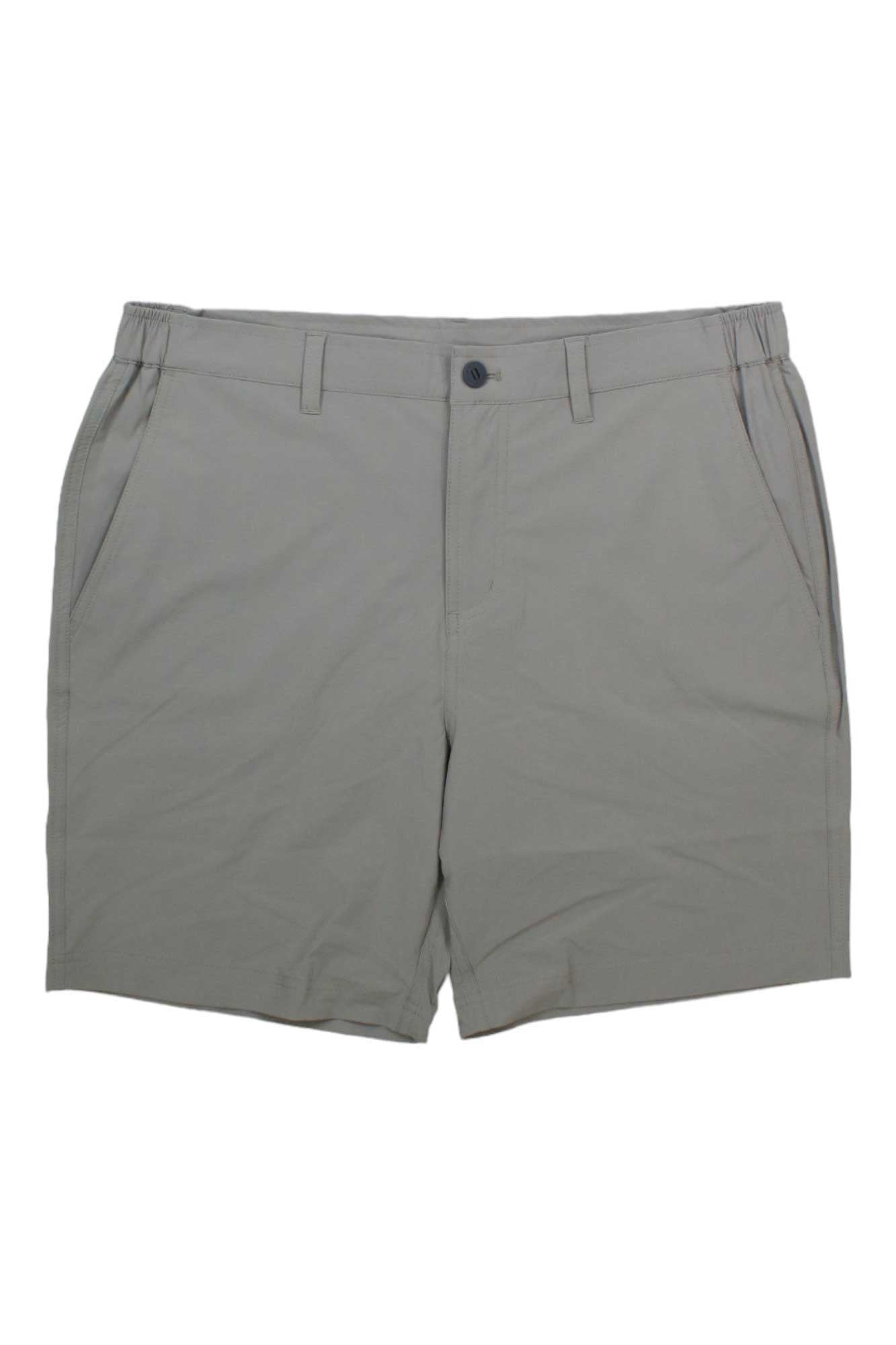The Free Fly Men's Latitude 7.5 Inch Short in light gray offers UV protection, an elastic waistband with belt loops, a front button and zipper closure, and two side pockets, shown laid flat on a white background.