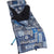 A blue and white patterned sleeping bag with a black interior lining, laid out on a blue folding cot, pairs perfectly with the Helinox Toasty Blanket for Sunset/Beach for extra warmth.