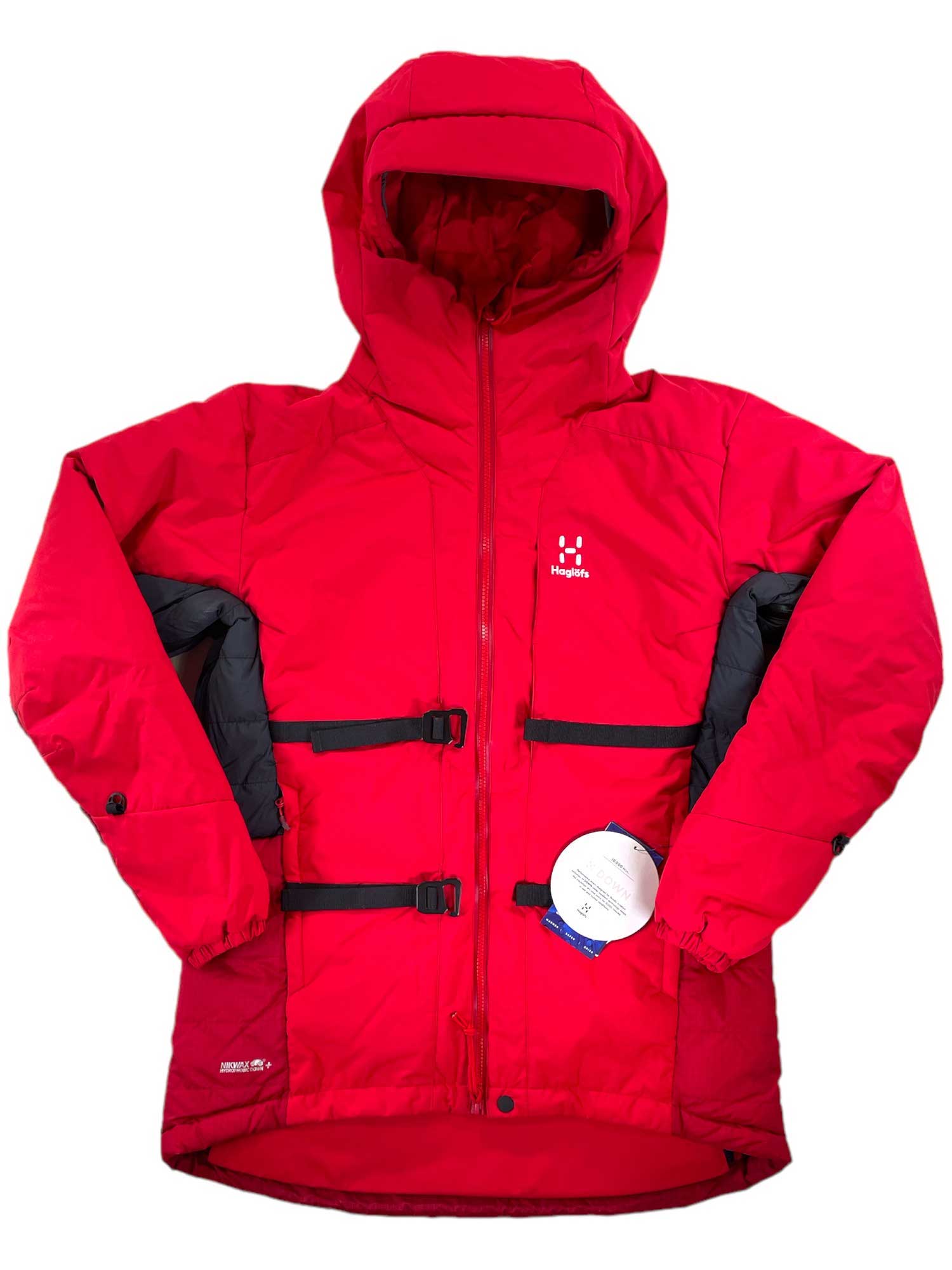 The Mens Nordic Expedition Down HoodJacket is bright red with black side panels, hydrophobic down insulation, dual black adjustable front belts, a zippered chest pocket, and a white round tag at the lower right side.