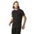 A man with shoulder-length light brown hair and a beard wears a plain black Smartwool Mens Merino Sport 150 Tee, which offers UPF 20+ sun protection, and black pants. He stands against a white background, looking slightly to the side.