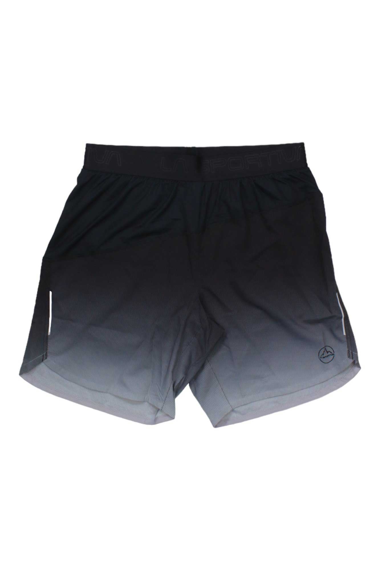 The La Sportiva Mens Medal Short is black with a subtle gradient, elastic waistband, and small reflective side details. These mountaineering shorts display the iconic logo near the bottom hem on one leg.