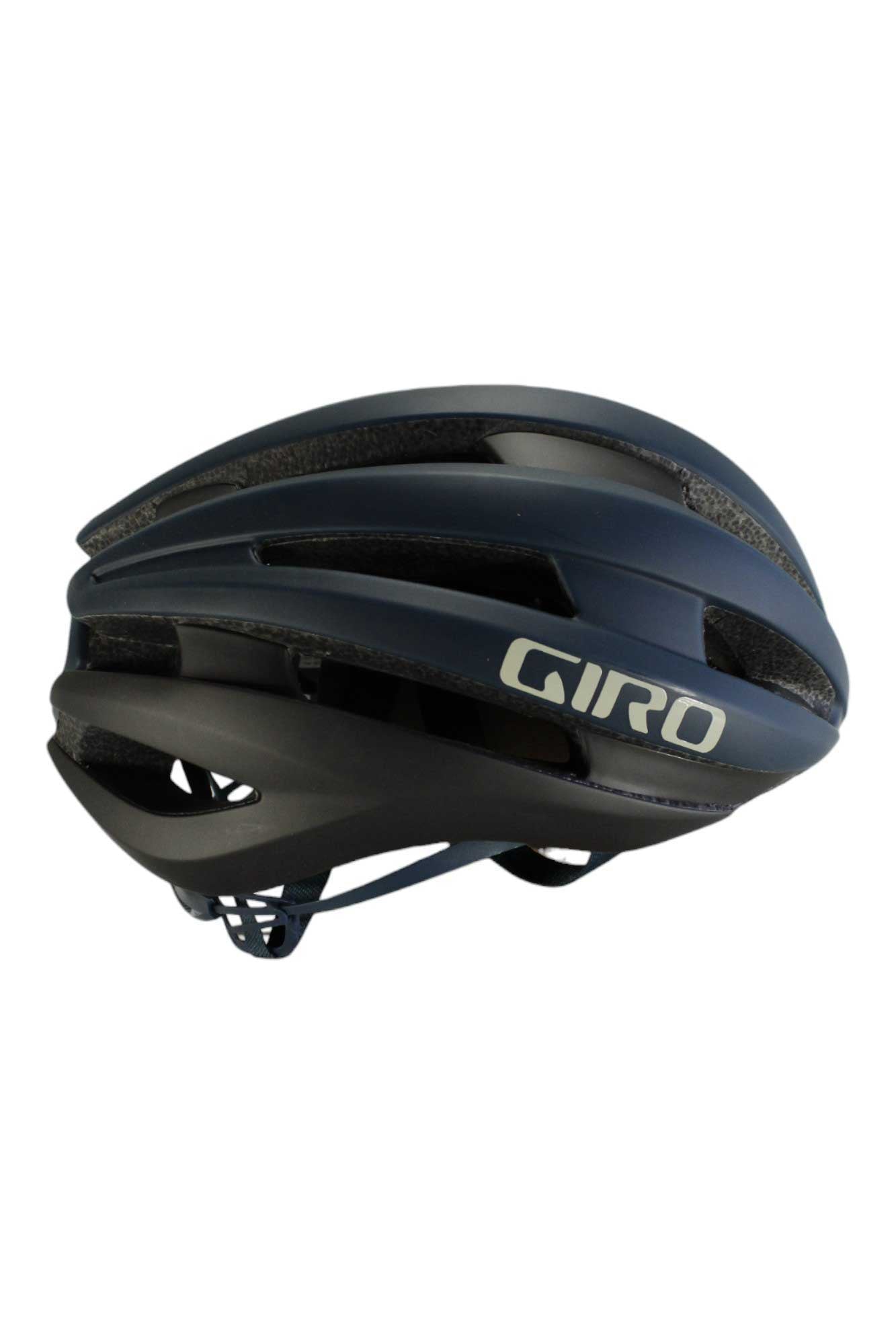 The Giro Synthe MIPS II Helmet in black and dark blue features an aerodynamic design with multiple ventilation slits, offering advanced MIPS protection—ideal for road cycling.