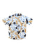 The KAVU Mens Topspot Shirt is a short sleeve button-up men's casual shirt featuring a blue, brown, and beige leaf pattern on a white background, displayed flat on a white surface.