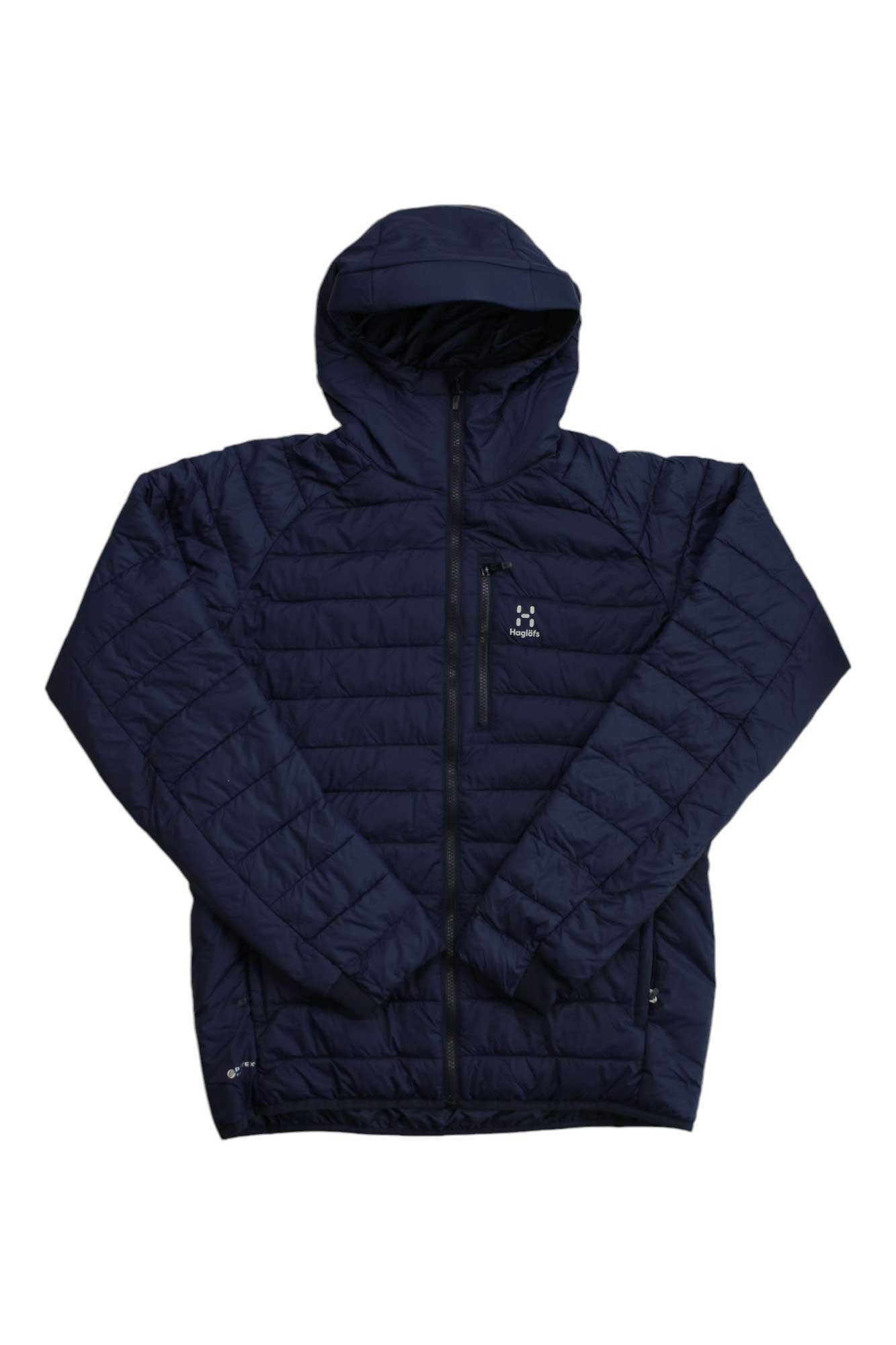 The Haglofs Mens Spire Mimic Hood Jacket is a navy blue, lightweight synthetic insulated jacket with a hood, front zipper, and zippered pockets. Wind-resistant and perfect for cold weather, it offers comfort and style.