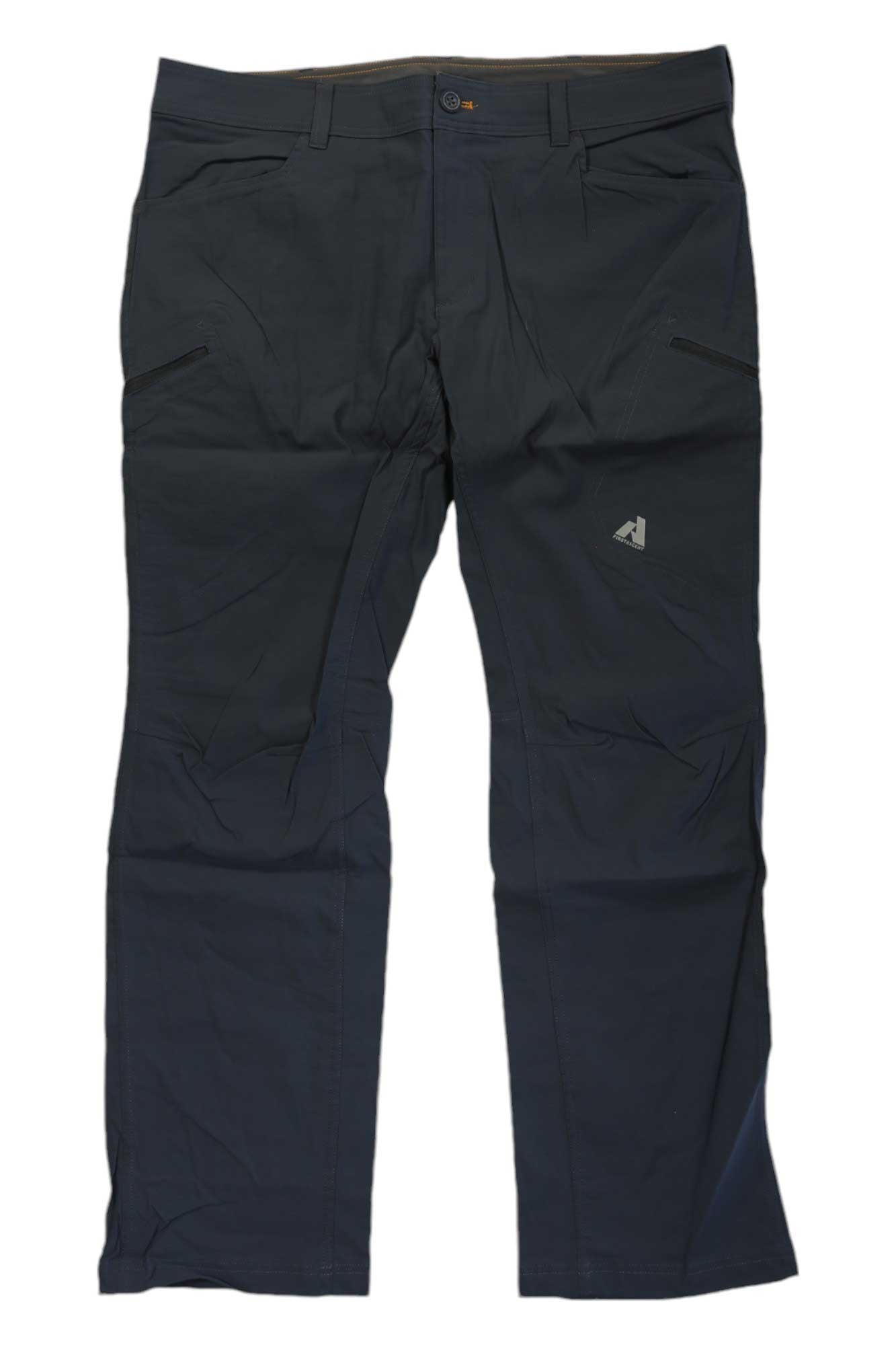 The Eddie Bauer First Ascent Men's Guide Pro Pant is a pair of dark, straight-leg hiking pants with front pockets, button closure, a small left thigh logo, and water-resistant fabric, shown laid flat on a white background.