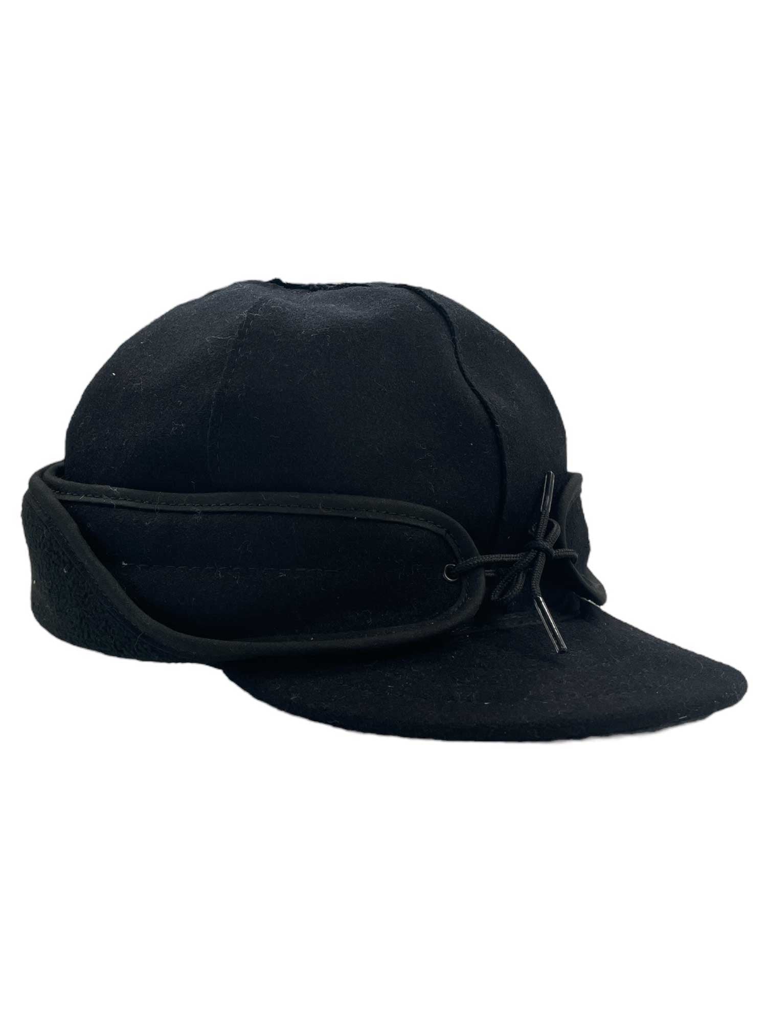 The Stormy Kromer Rancher Cap is a black trapper-style hat with ear flaps that tie at the front, Thinsulate Insulation for warmth, a soft rounded crown, and a short curved brim.