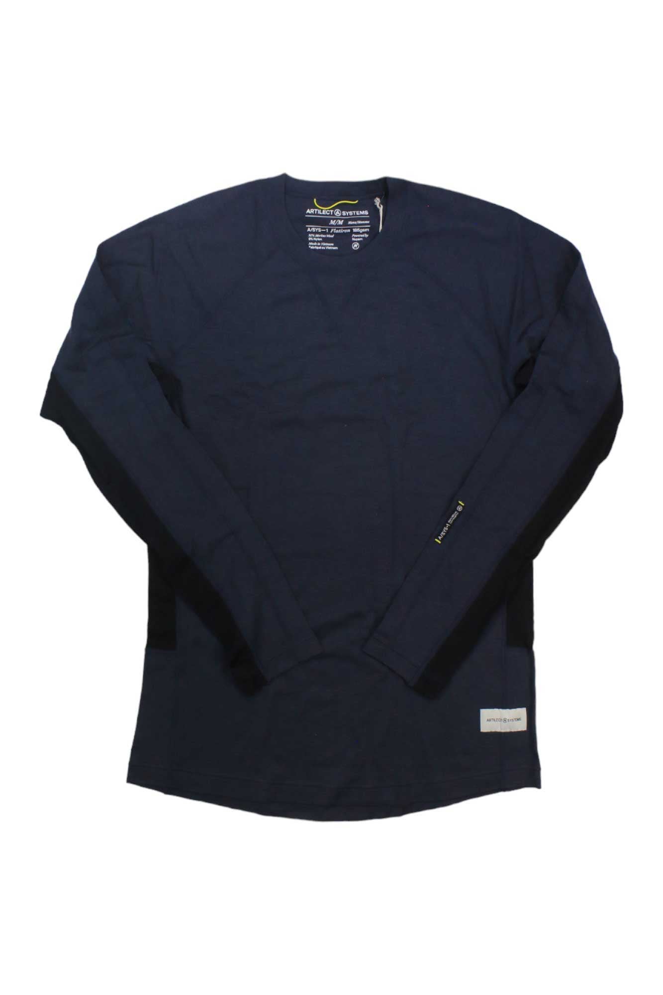 The Artilect Men's Flatiron 185 Crew Top, a navy blue long-sleeve crew neck made from moisture-wicking fabric, is laid flat on a white background with tags near the collar and hem highlighting its performance as a base layer.