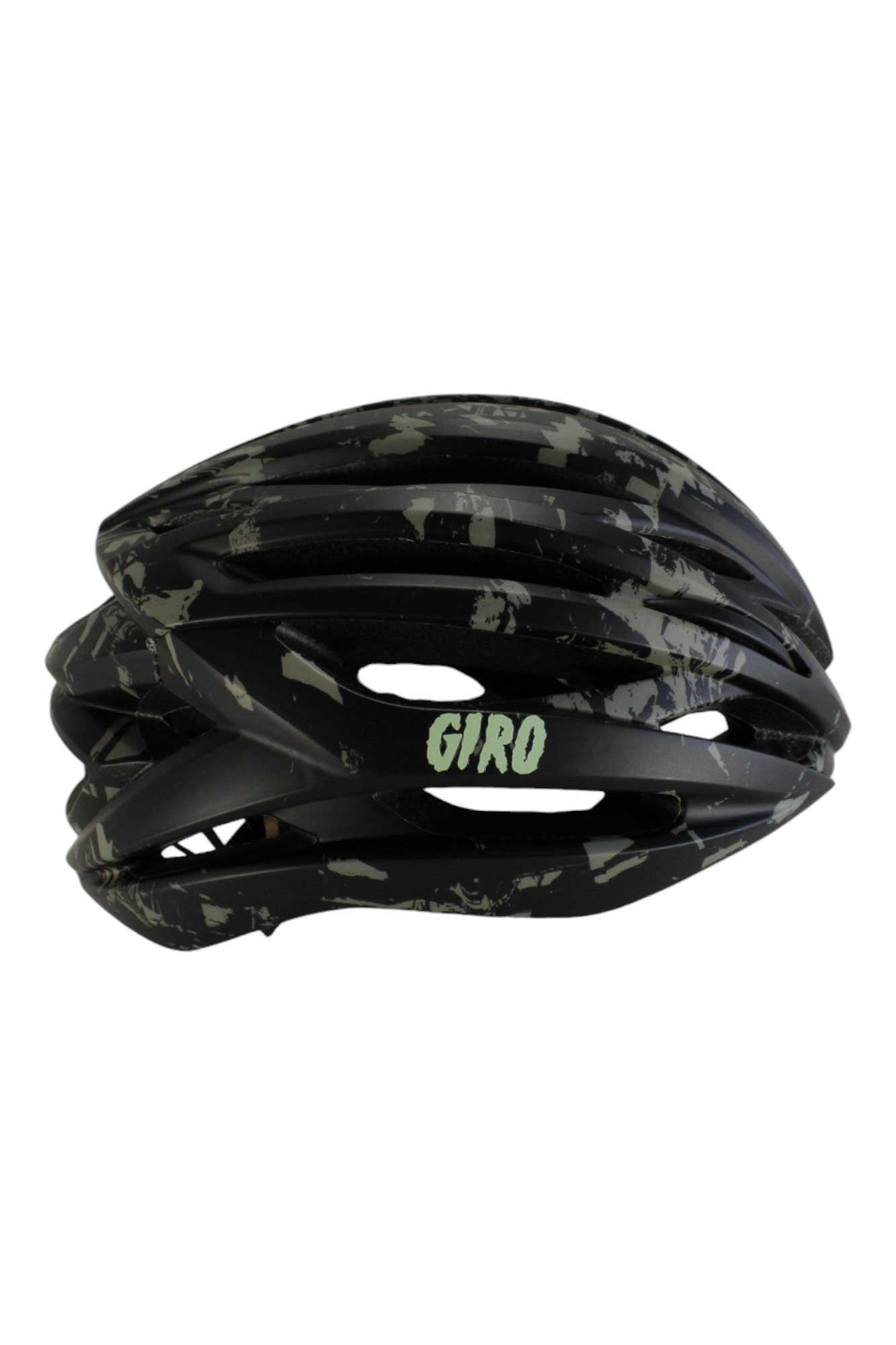 The Giro Syntax MIPS Helmet features a black and gray camouflage pattern, multiple air vents, GIRO in light green text on the side, and advanced MIPS technology for enhanced cycling safety.