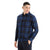 A young man smiles in the Icebreaker Mens Dawnder LS Flannel Shirt Plaid, blue and black, paired with black pants, set against a plain white background.