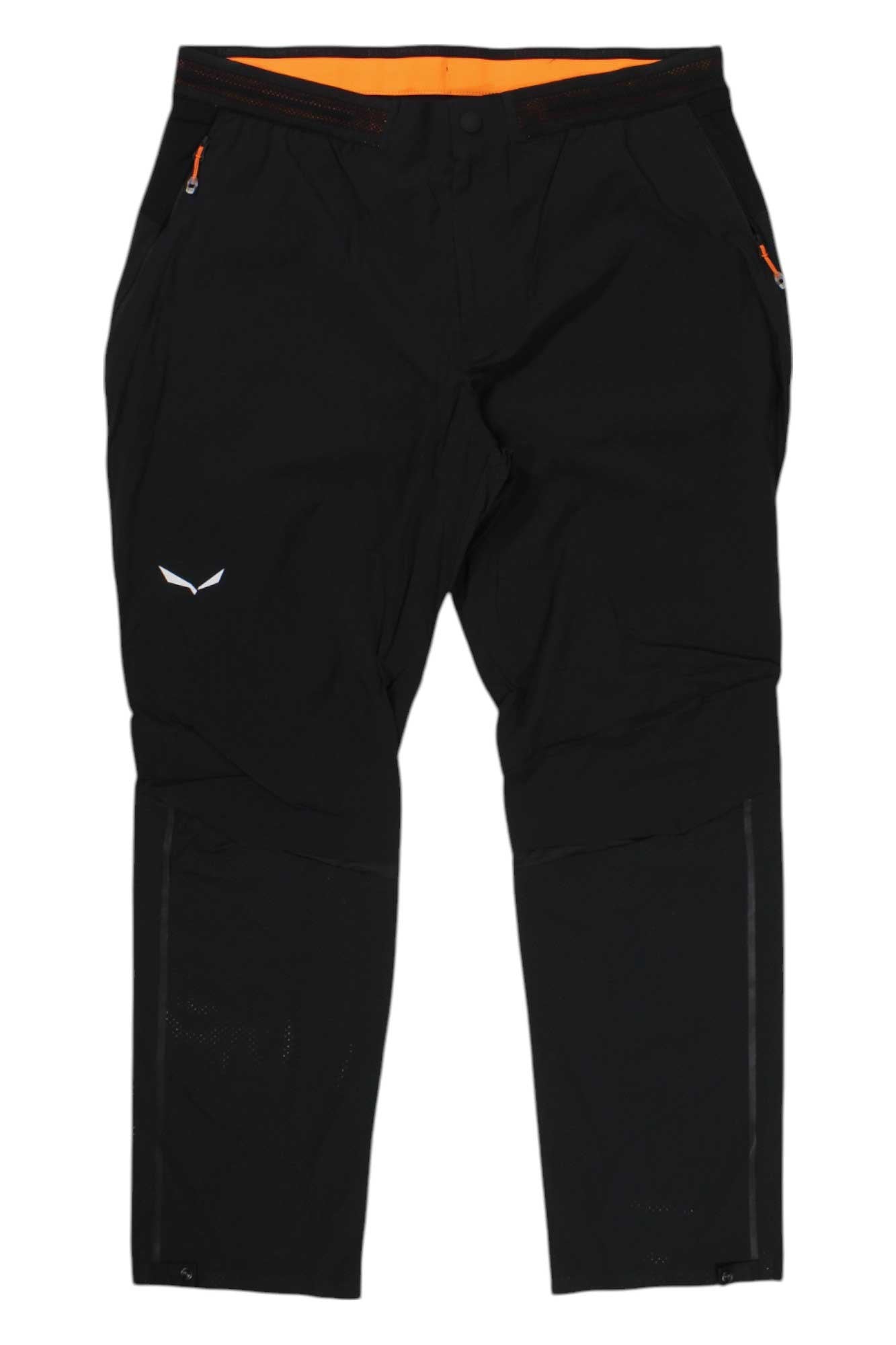 Salewa Mens Pedroc Pro DST Pant in black with zippered pockets and orange accents, shown flat on a white background. Features a small white logo on the upper thigh and convenient lower leg zippers—ideal for hiking.