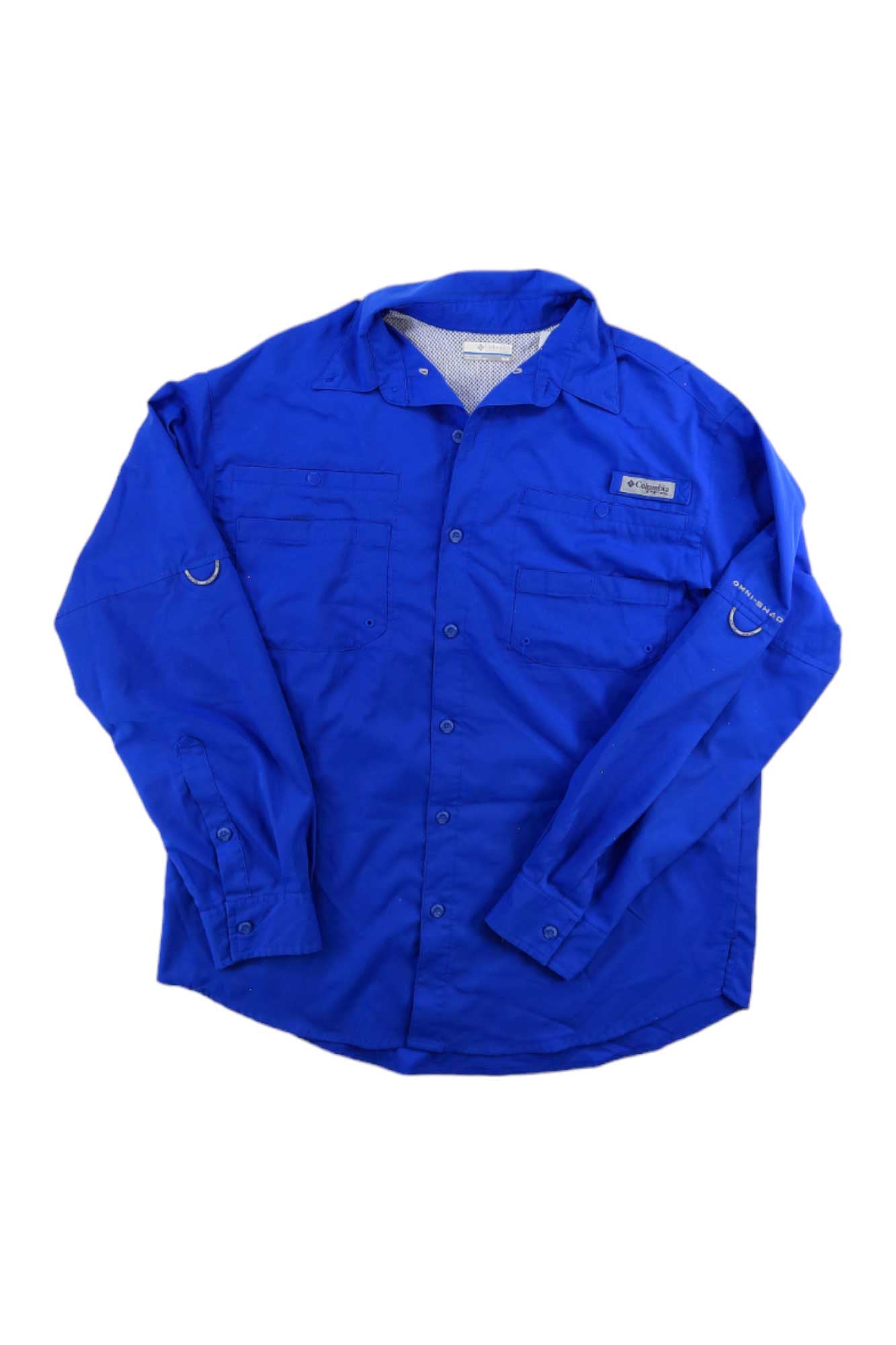 The Columbia Mens Tamiami II LS Shirt features long sleeves, a bright blue color, two chest pockets, adjustable cuffs, and sleeve loops, shown laid flat on a white background.