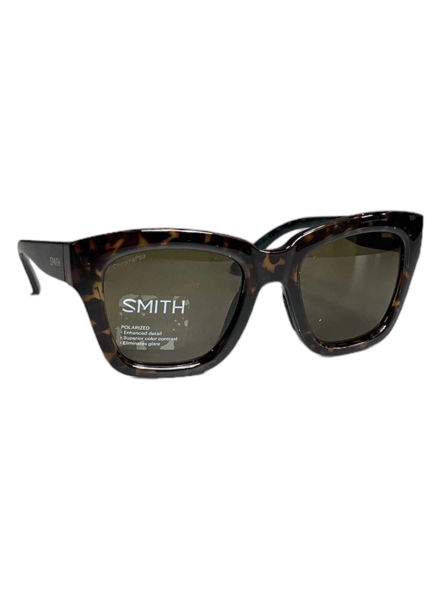 Smith Sway Polarized Sunglasses feature a tortoiseshell pattern, dark ChromaPop polarized lenses, and a slight cat-eye shape. Lightweight and durable frames offer comfort, with the Smith logo on the left lens.