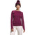 A woman wearing a maroon The North Face Womens Fd Pro 160 Crew, white pants, and a maroon pom-pom beanie stands against a plain white background.