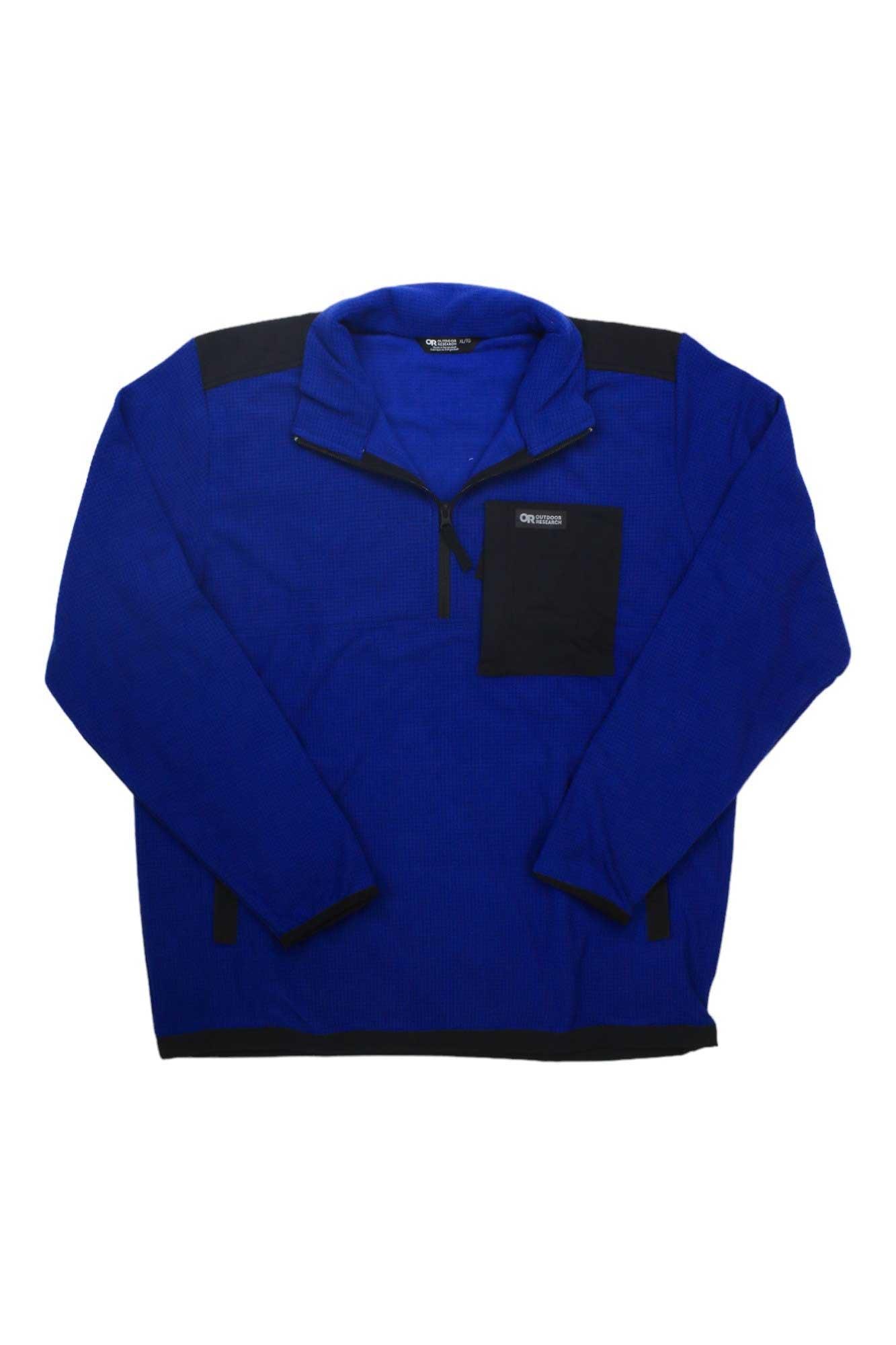 The Outdoor Research Men's Trail Mix Quarter Zip Pullover is blue with black shoulder patches and a left chest pocket, made from moisture-wicking fabric—ideal for hiking adventures.