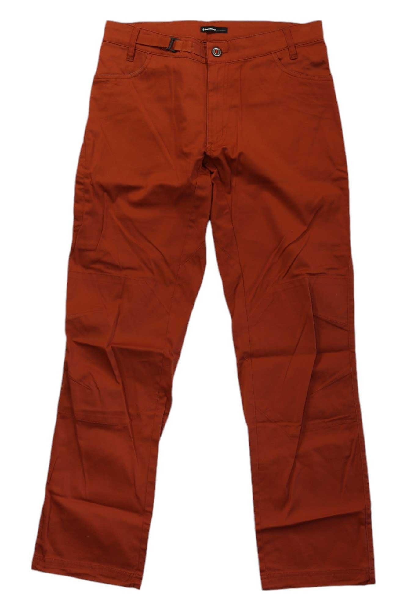 A pair of orange-brown Black Diamond Mens Credo Pant, made from organic cotton with belt loops and front pockets, is laid flat on a white background.