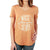 A person wears a Moosejaw Womens Steak and Eggs Flowy V-Neck SS Tee in orange, featuring "Moosejaw Nice Stuff est. 1992" in white inside a circle. The vintage wash tee is shown from shoulders to hips, with one hand at their side and one on their hip.