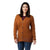 A woman with straight dark hair smiles, wearing the Smartwool Womens Cozy Lodge Boyfriend Cardigan over a maroon top and blue jeans, standing against a plain white background.