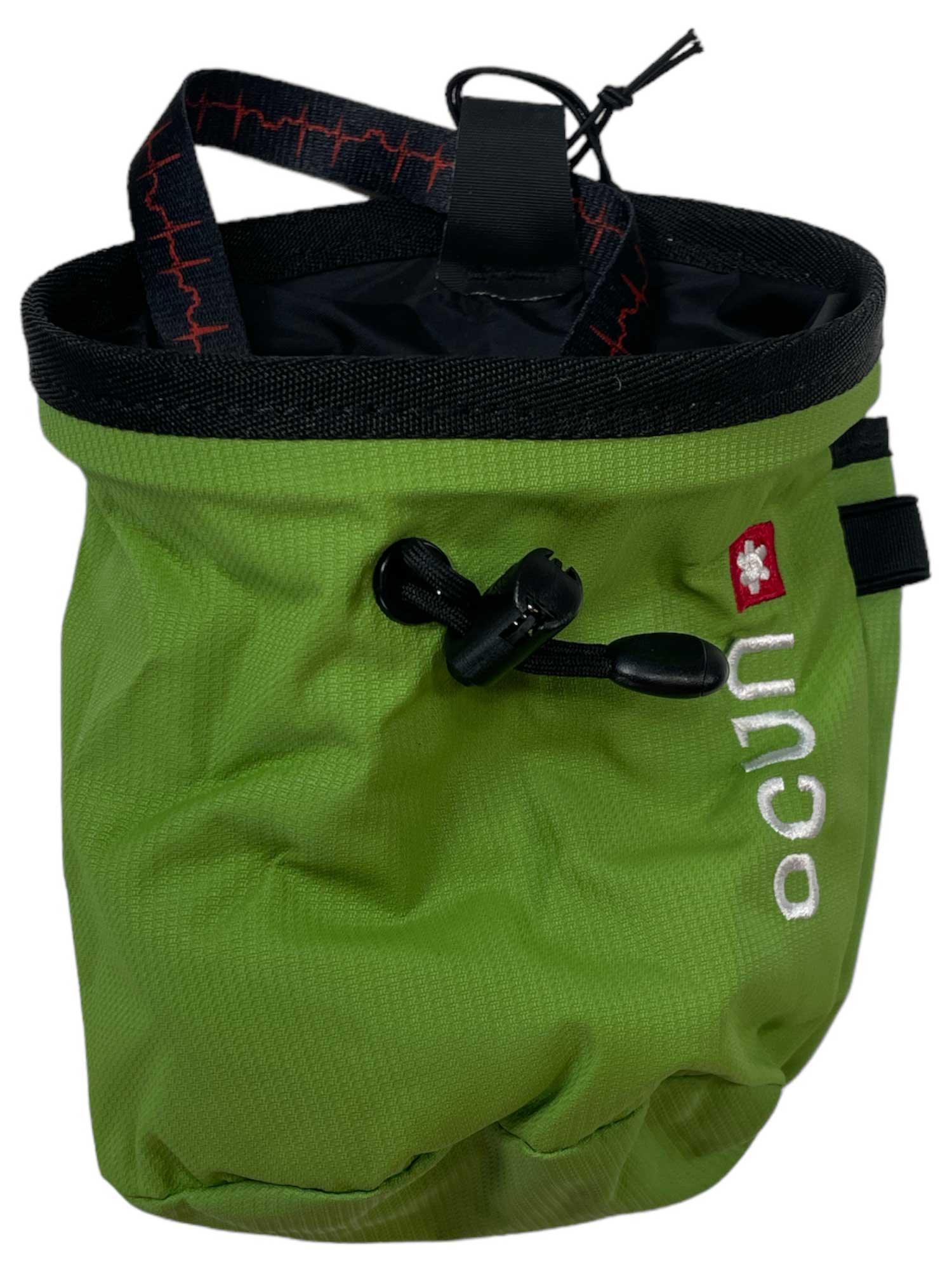 The Ocun Push Plus Belt Chalk Bag is green with a black rim, drawstring closure, and red tag. It has the vertical "ocun" logo in white on the front and features a black strap with red stitching—ideal for climbers’ harnesses.