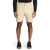 A person wearing The North Face Men's Project 8 Inch Short in beige, paired with a long-sleeve black shirt and black sneakers with white soles, stands against a plain white background.