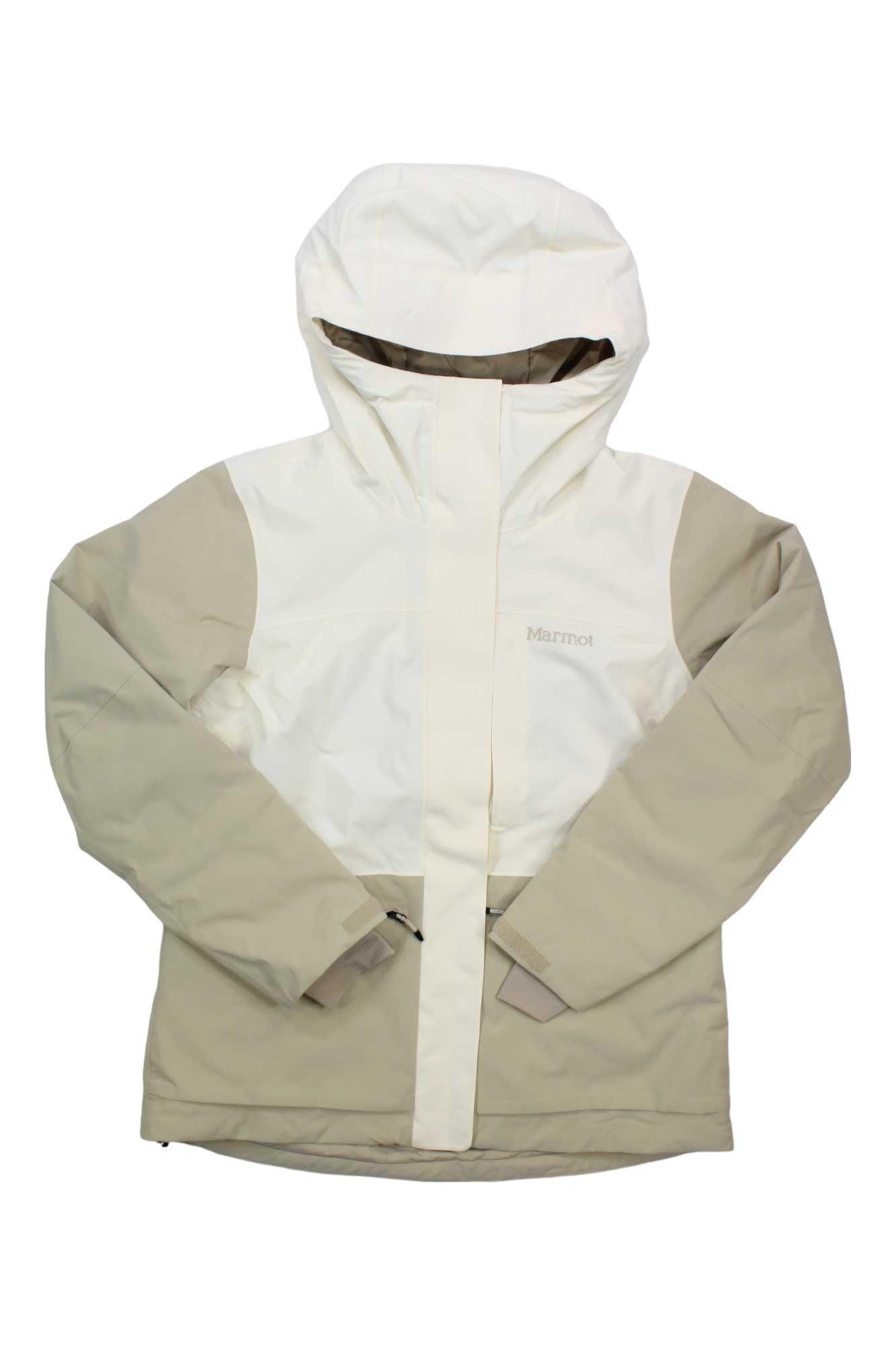The Womens Refuge Jacket is a beige and off-white eco-friendly outdoor jacket with a hood, front zipper, Velcro closures, long sleeves, and a high collar. This lightweight waterproof jacket is ideal for outdoor activities.
