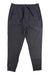 The SAXX Mens Trailzer Jogger, made from dark gray recycled polyester, features an elastic waistband, drawstring, and two zippered side pockets, shown laid flat on a white background.