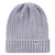 The Smartwool Rib Hat is a light gray, ribbed knit beanie made from soft Merino wool, featuring a folded brim and a small tag with colorful stripes and a person icon—an ideal winter hat.