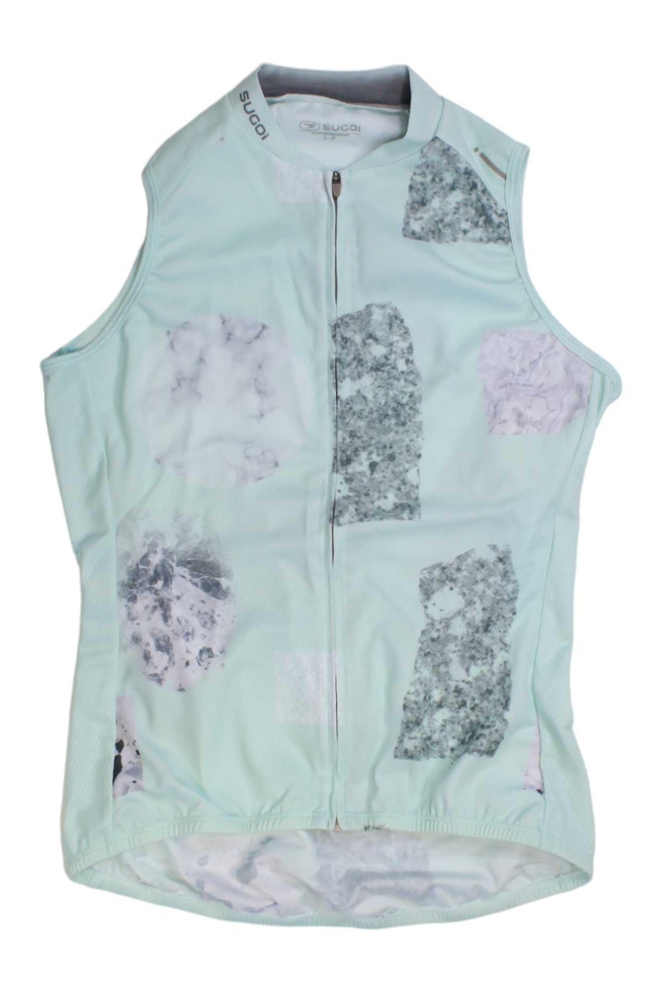 The Sugoi Women's Evolution Zap SL Jersey is a sleeveless, pastel cycling jersey with marble patterns in grey, black, and light purple. It features a front zipper, elastic waistband, and moisture-wicking fabric for comfort.