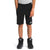 A child in a gray T-shirt, The North Face Boys' Slacker 8 Inch Short with an adjustable waist and hands in pockets, plus black high-top sneakers, stands against a white background.