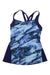 The TYR Women's Shale Lola Tank features crisscross straps, a blue and black marble-inspired front, navy side panels, and UPF 50+ sun protection—perfect for stylish performance indoors or outdoors.