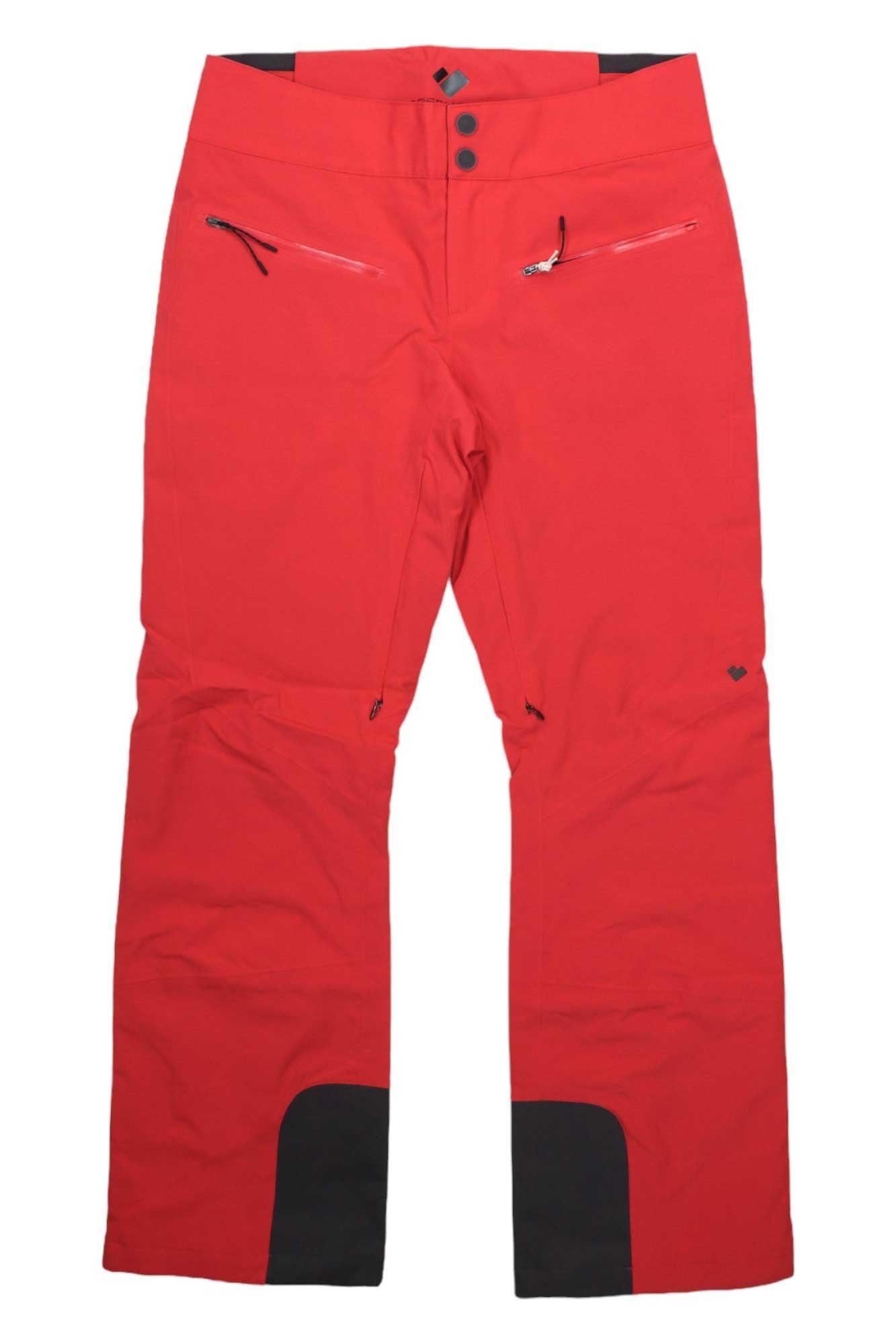 The Obermeyer Womens Bliss Pant features a bright red color with black cuff accents, two zippered front pockets, and a button-zip waist closure. These insulated ski pants are shown on a white background.