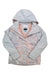 The Roxy Womens Jetty Block Jacket is displayed in light gray with a marbled pastel pink, blue, and white design, hood up and front partly unzipped to show the inner label of this waterproof ski jacket.