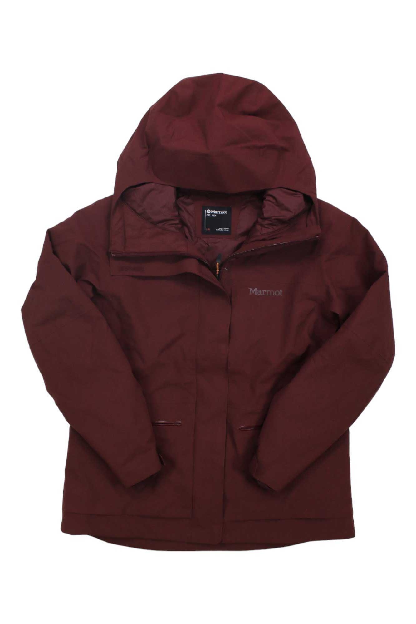 The Womens Refuge Jacket in maroon features a hood, front zipper, and two side pockets. Laid flat on a white background, this eco-friendly Marmot jacket blends outdoor style with protection.