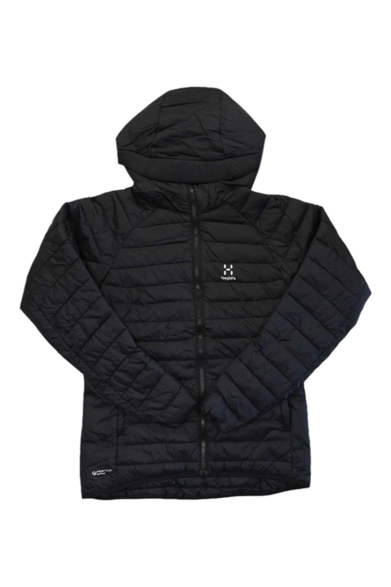 The Haglofs Womens Spire Mimic Hoodie is a black quilted jacket with synthetic Mimic Gold insulation, a front zipper, two side pockets, and white logos on the left chest and near the left hem.