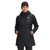 A woman stands facing forward with hands in pockets, wearing The North Face Womens ThermoBall Eco Parka—an insulated black jacket crafted from recycled nylon—set against a plain white background.