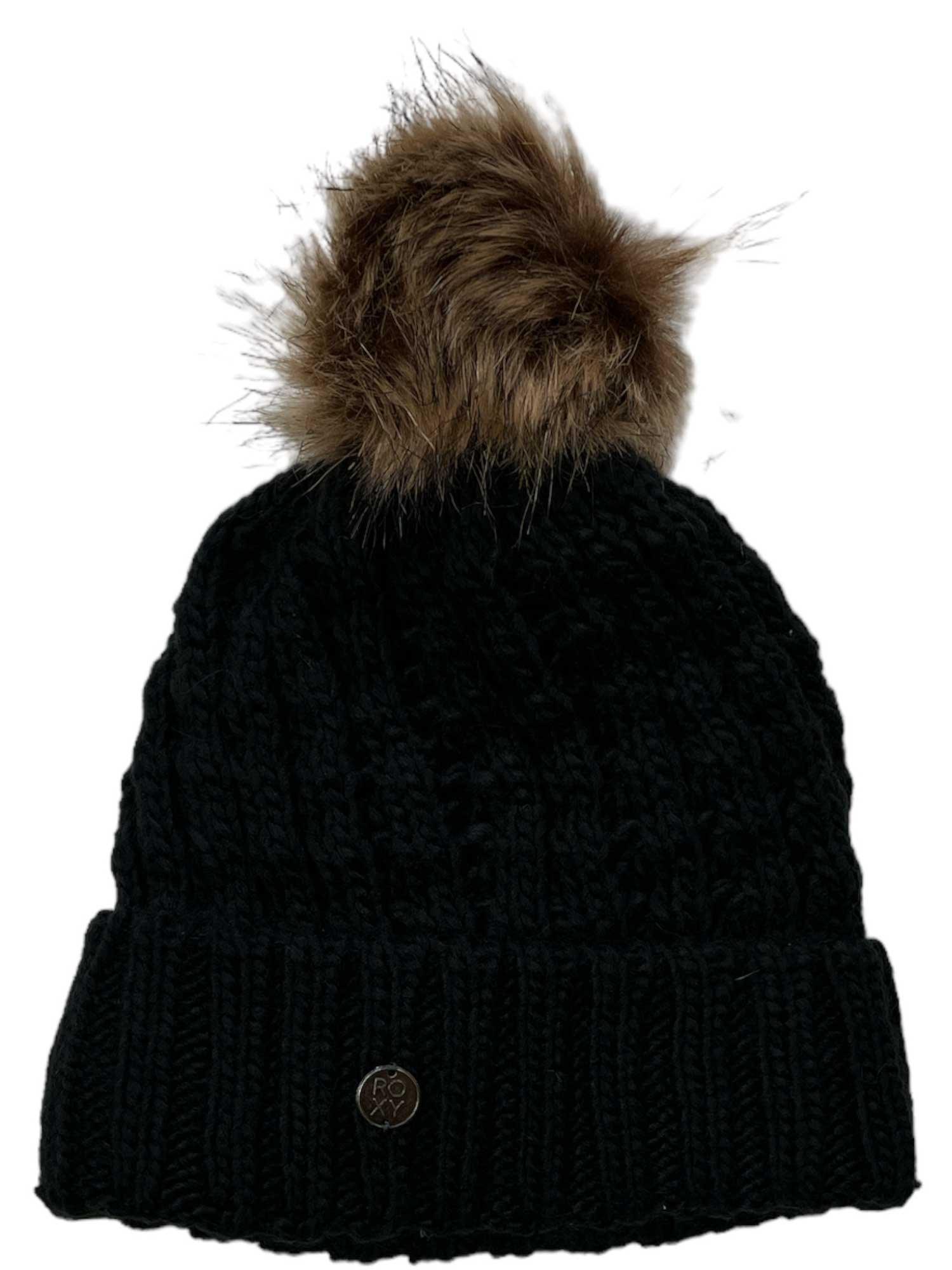 The Roxy Girls' Blizzard Beanie is a black knit winter hat with a thick, ribbed folded brim, a large brown faux fur pom on top, and a cozy fleece-lined interior for extra warmth.
