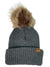 The Stormy Kromer The Snowfall Beanie is a gray knit hat with a folded brim, a large faux fur pompom on top, and a small brown tag on the front for added style.