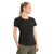 A woman with blonde hair in a ponytail wears an Icebreaker Womens Central Classic SS Tee in plain black and olive green cargo pants, standing against a white background and looking slightly to her left.