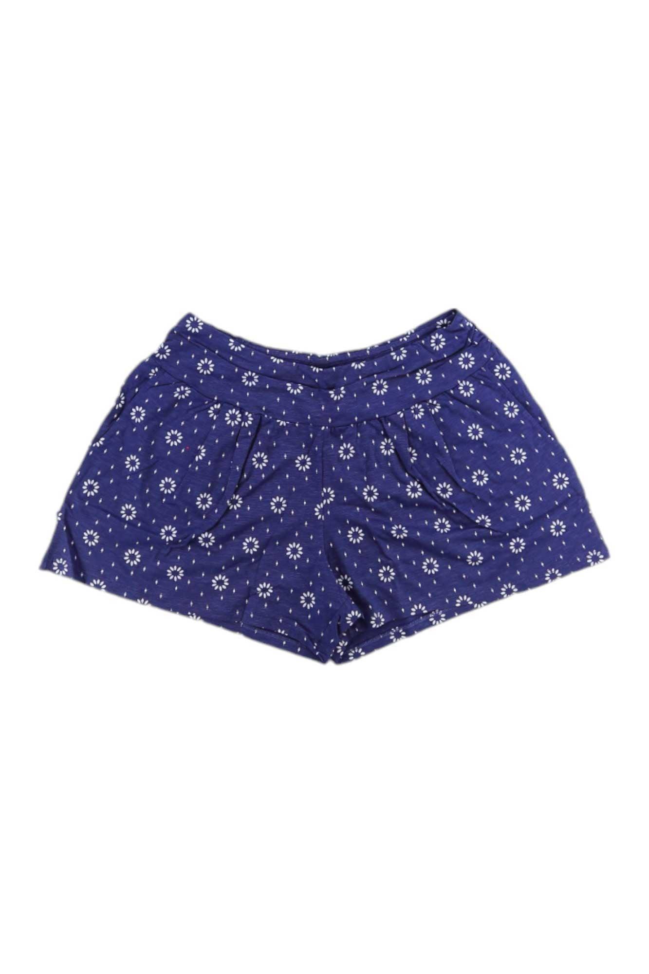 The Toad & Co Women's Chaka 4 Inch Short in navy blue features a white floral pattern, is made from organic cotton, and is shown flat on a white background.