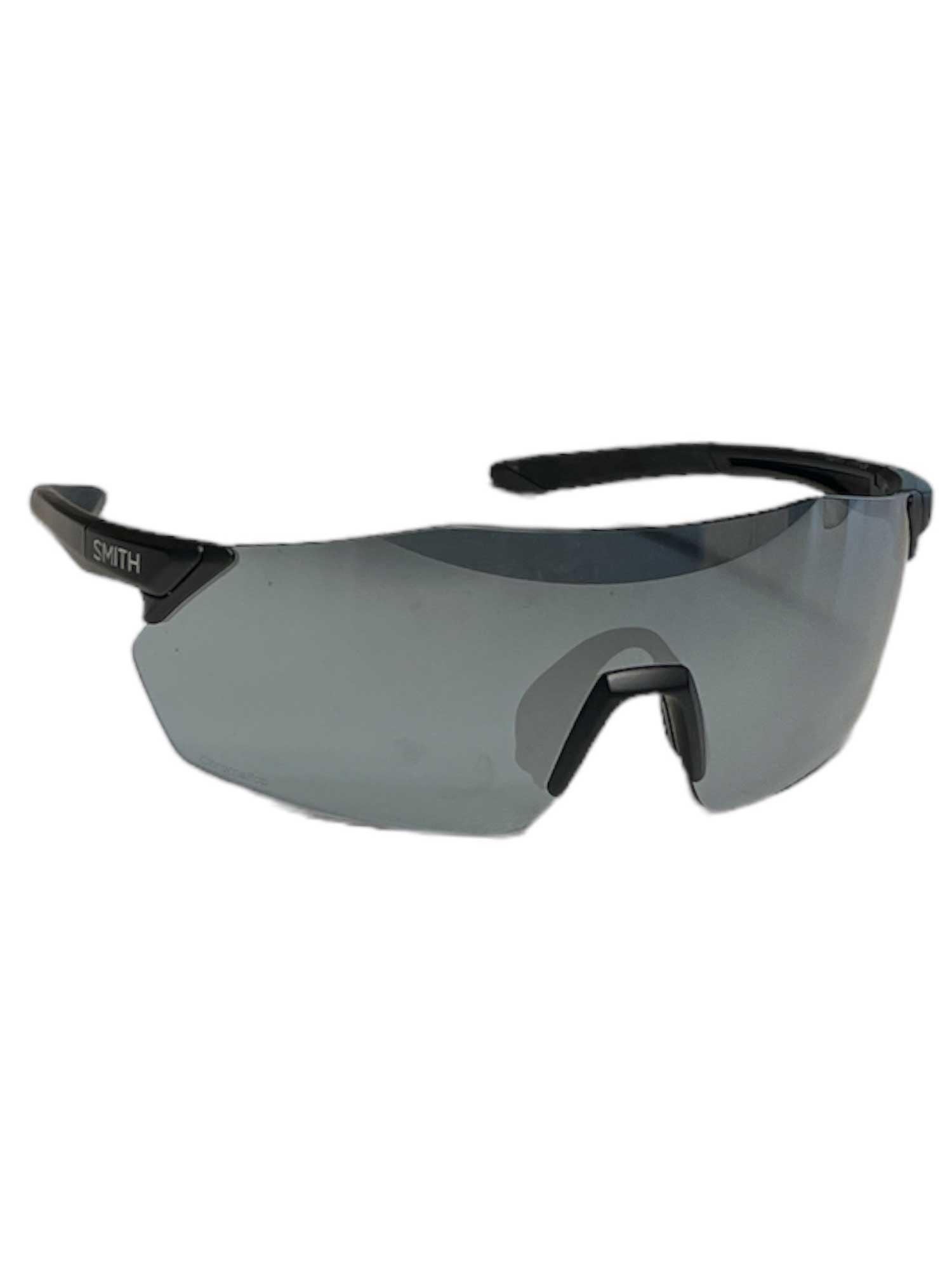 The Smith Reverb ChromaPop Sunglasses feature a sporty wraparound design with a single curved gray lens, black TR90 frame, adjustable nose pads, partially rimless construction, and a Smith logo on the left temple.