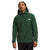 A person wearing The North Face Mens Canyonlands High Altitude 1/2 Zip Top in dark green, made from recycled polyester with a zippered chest pocket, stands against a plain white background.