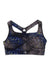 The Sweaty Betty Women's Power Medium Impact Sports Bra features a geometric black, blue, white, and yellow pattern, racerback design with triangle cutout, moisture-wicking fabric, and mosaic-style—ideal for yoga or active days.