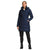 A person faces forward against a white background, wearing The North Face Womens Metropolis Parka in navy blue, paired with black pants and black boots.