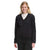 A smiling woman with long blonde hair wears The North Face Womens Mountain Sweatshirt Hoodie, a black zip-up, over a white shirt and black pants while standing against a plain white background.