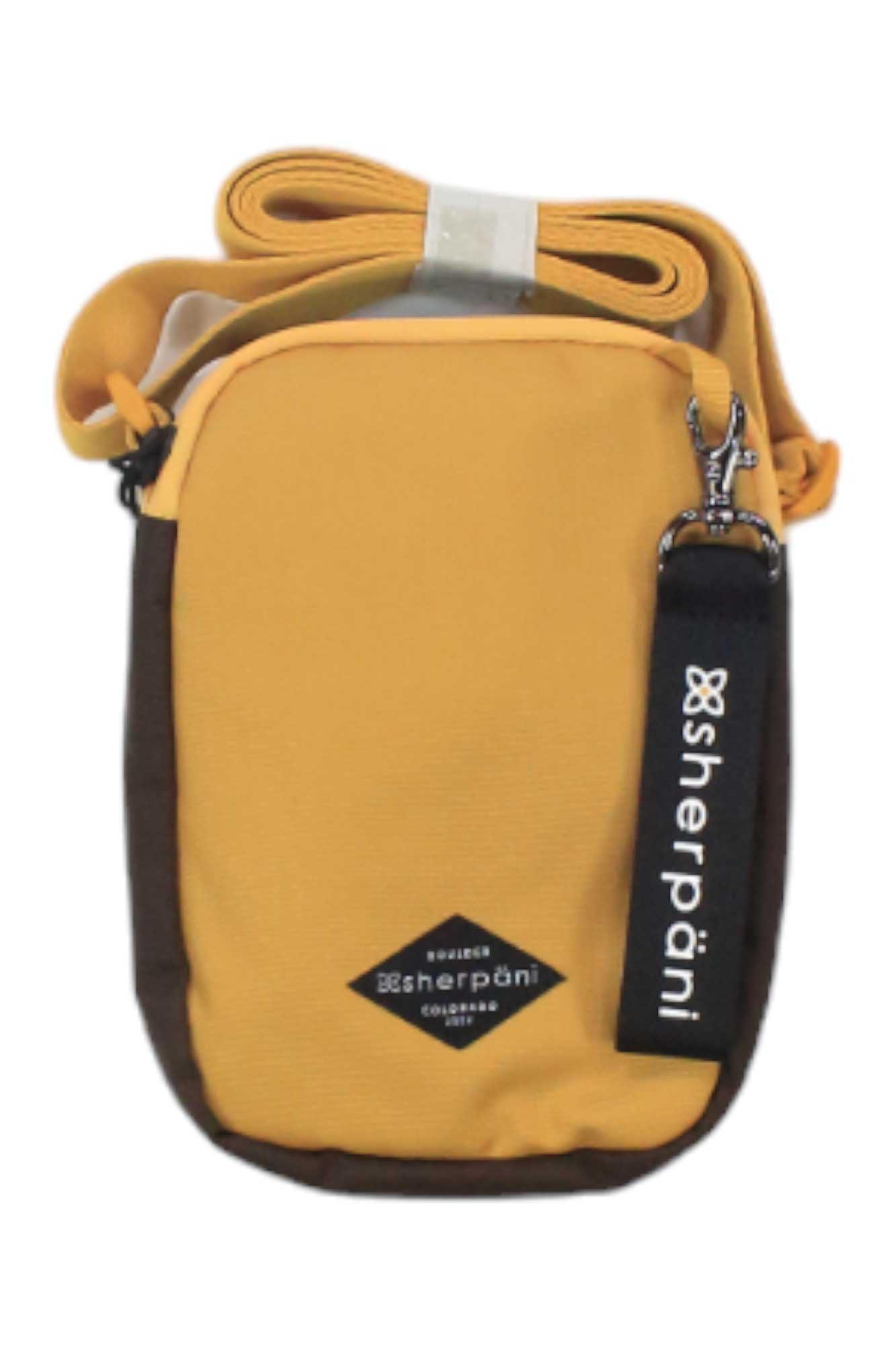 The Sherpani Women's Rogue Mini Crossbody Bag is a small, rectangular yellow bag with brown sides, made from recycled polyester. It has a long yellow strap, a black Sherpani zipper pull, and a front logo patch—ideal for women.