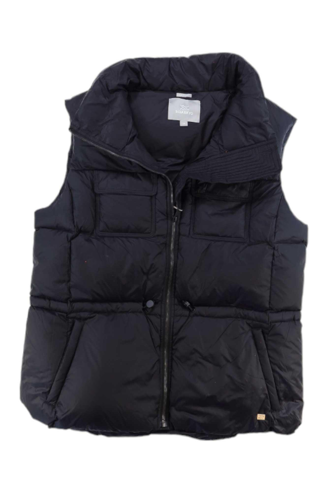 The Soia & Kyo Womens Deanna Vest is a black, sleeveless, insulated vest for women featuring a water-repellent finish, front zipper, two spacious front pockets, and a high collar; shown on a white background.
